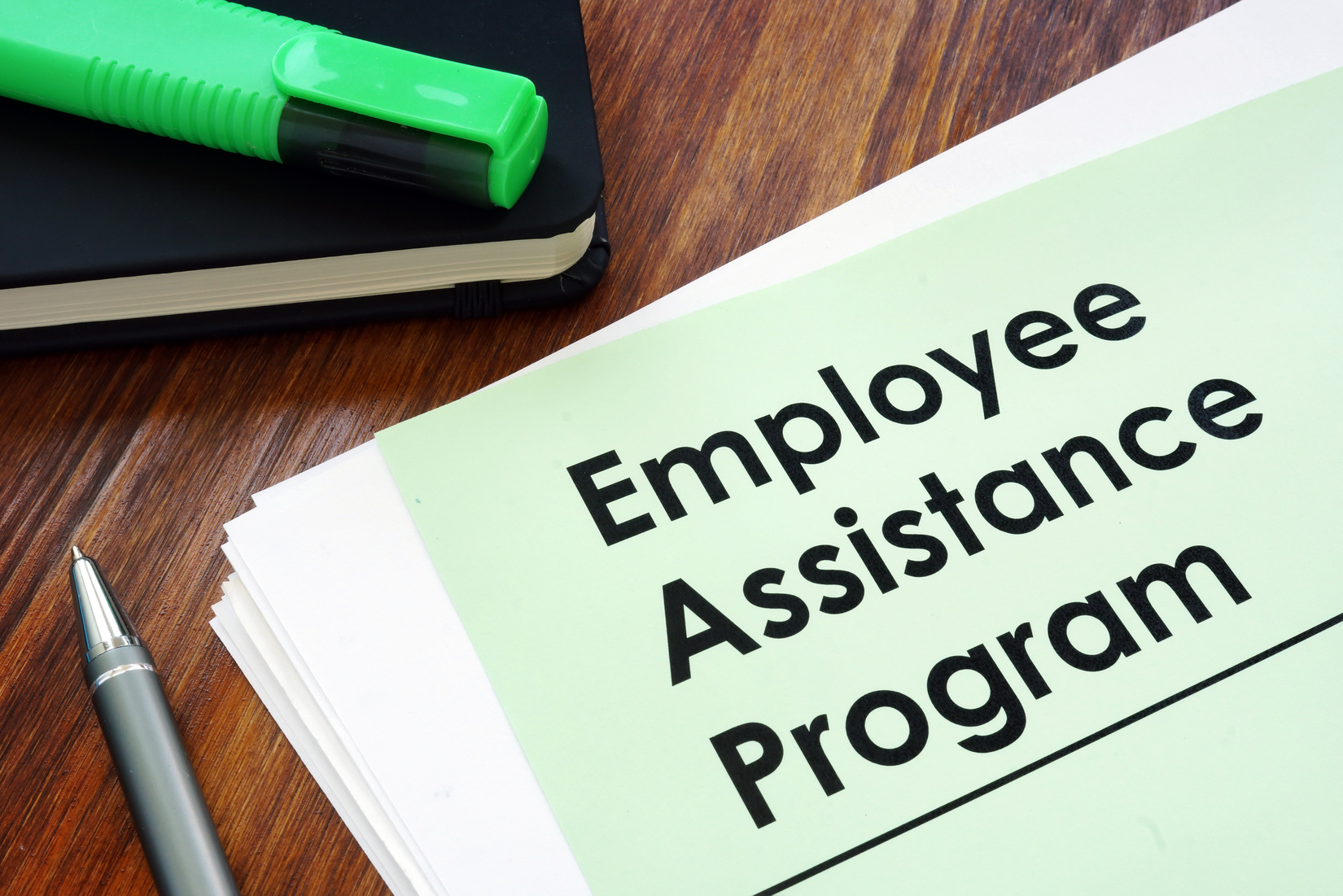 Employee assistance program EAP - benefit program on the desk.