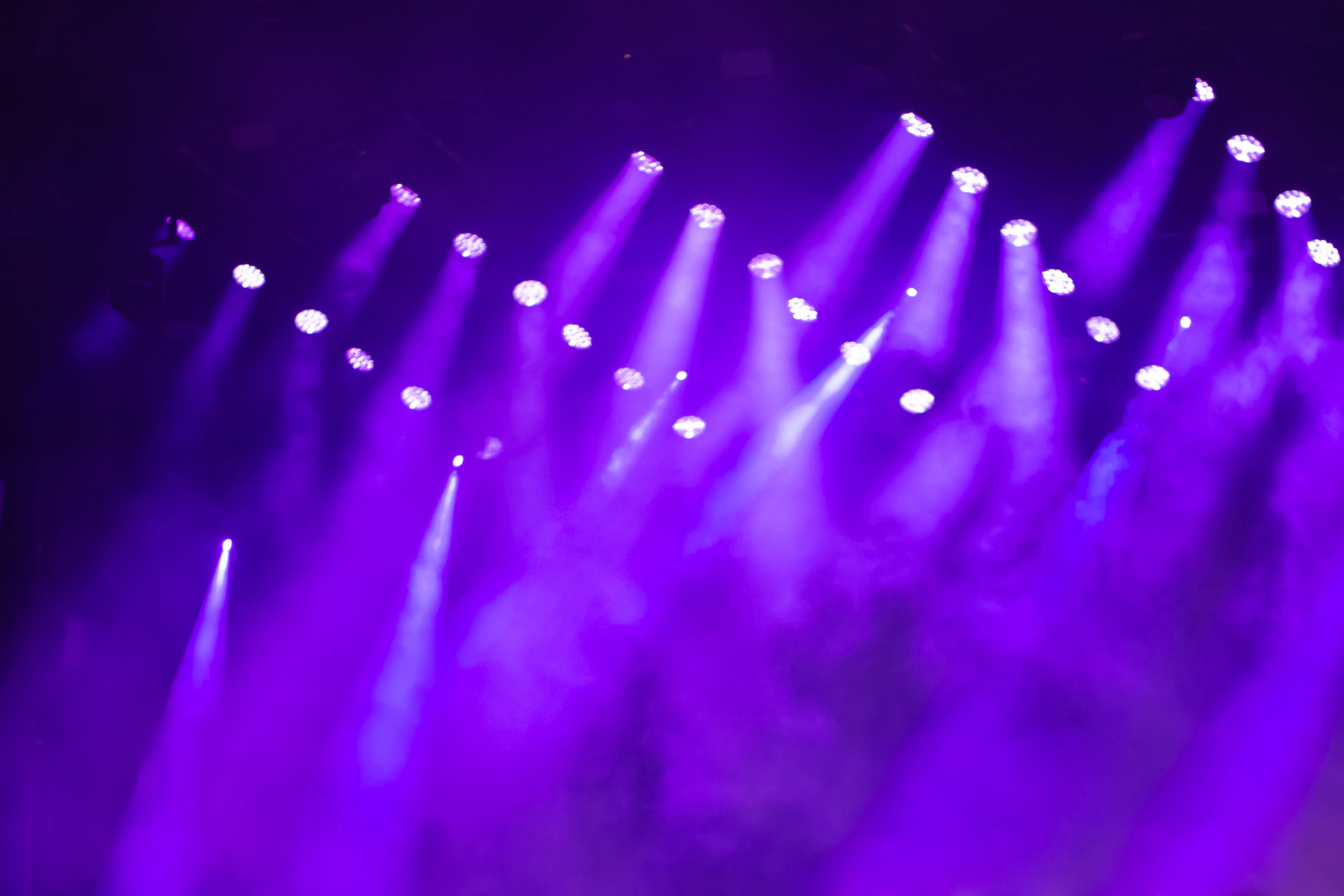illumination at a music concert, purple background,